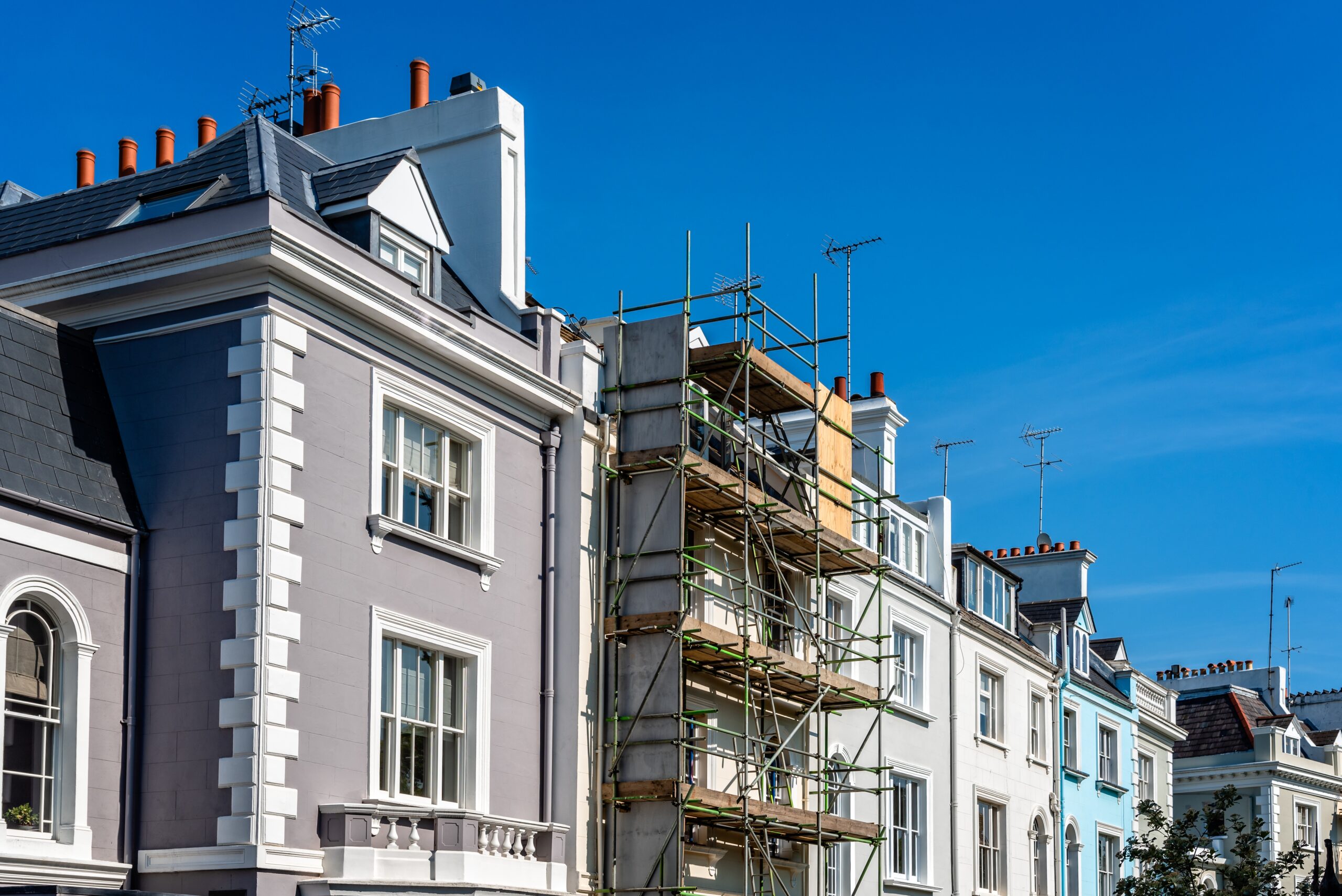 Residential building exterior retrofit with EIFS insulation