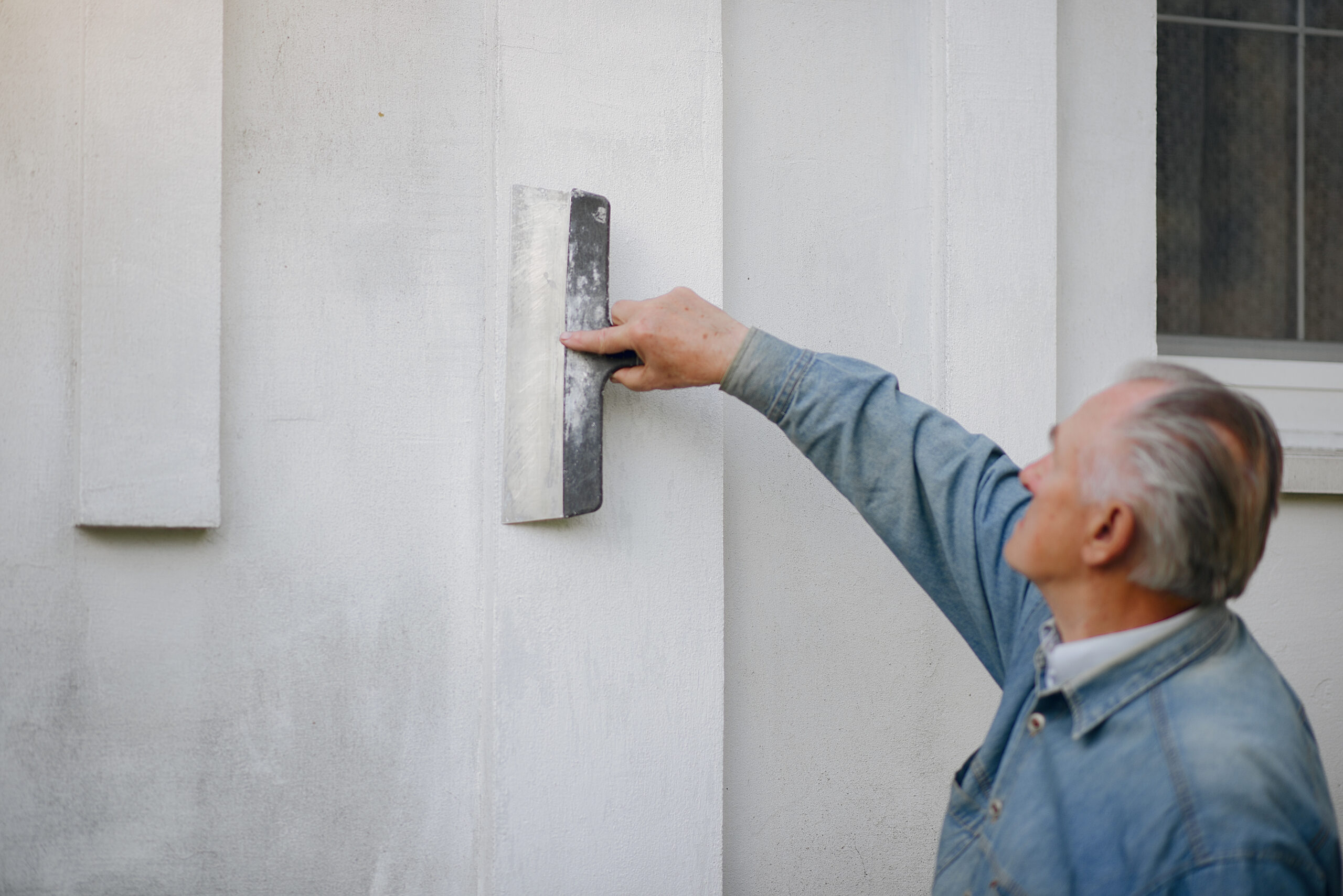 Exterior cement plaster on building facade — weather resistant